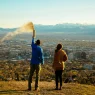 people spreading ashes from an urn