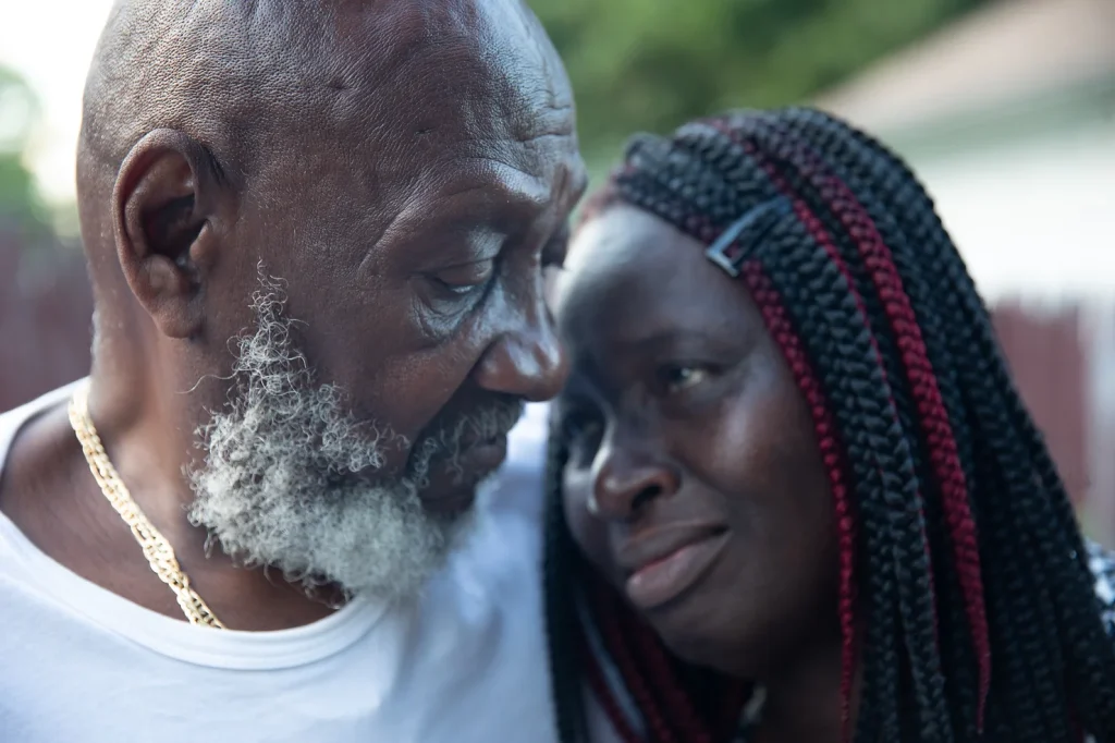 older father and daughter sharing a moment