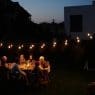 family sitting by table at garden